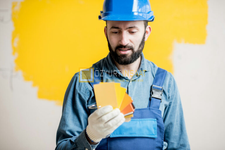 Painter with color swatches indoors